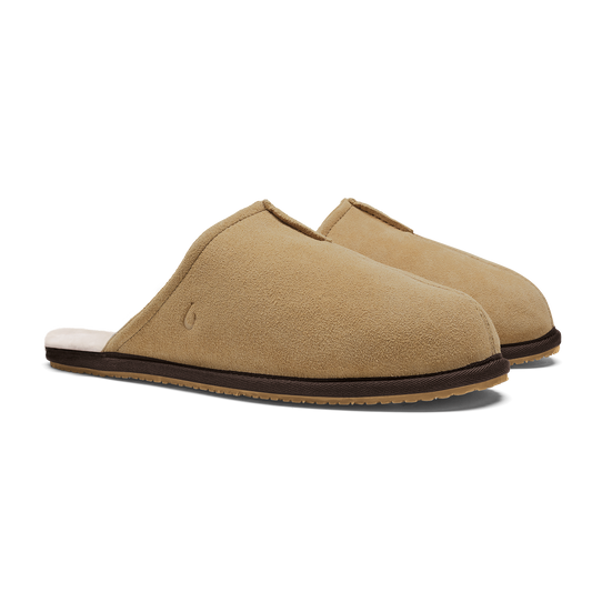 Pair of tan suede slip-on slippers with dark brown trim and crepe sole.