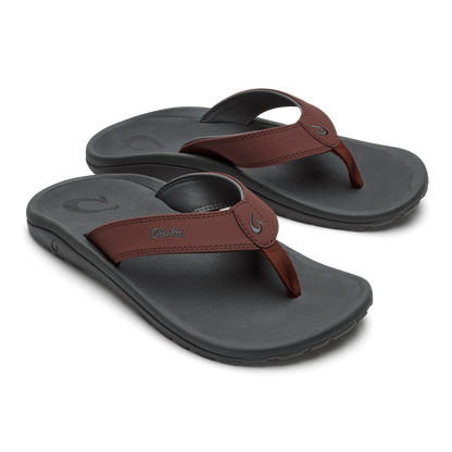 Pair of charcoal flip-flops with burgundy leather straps and curved arch support footbeds.