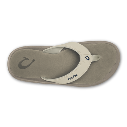 Beige and gray thong sandal with curved footbed and toe post strap, viewed from above.