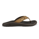 Tan leather thong sandal with black sole and island chain design detail on strap.