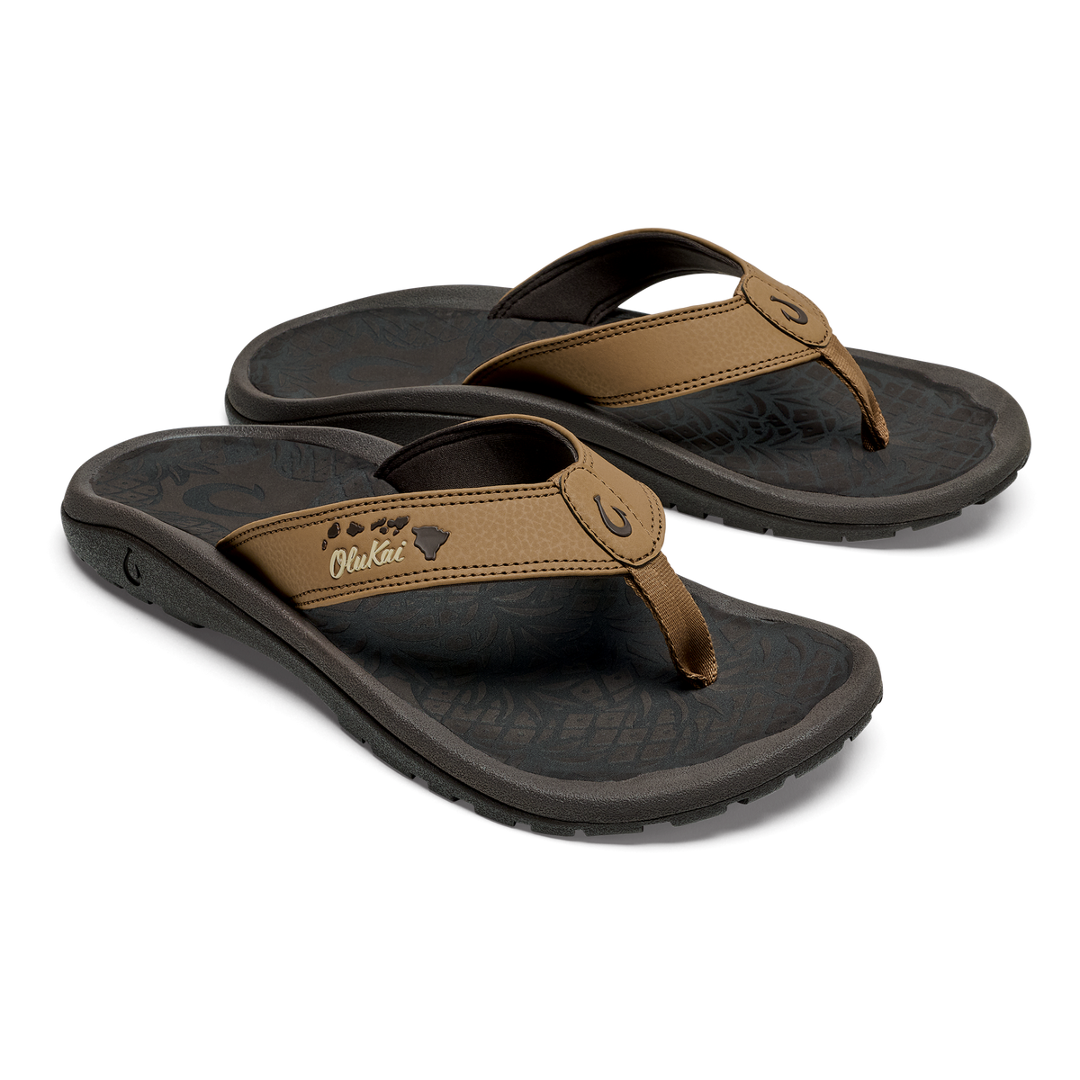 Tan and black thong sandals with cushioned footbeds and embroidered island chain design on strap.