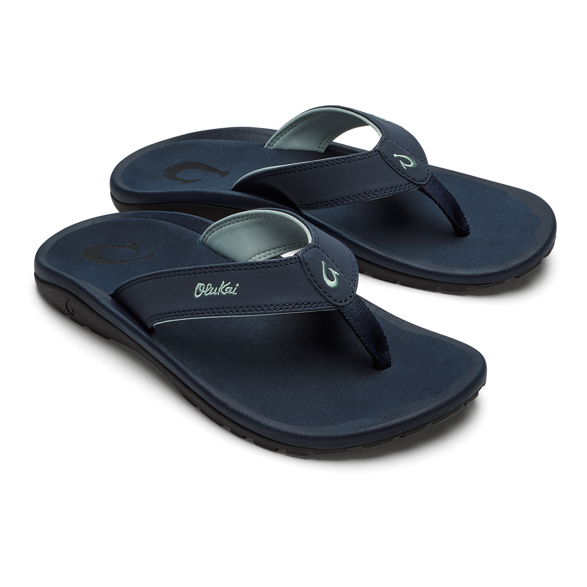 Pair of dark blue thong sandals with cushioned soles and adjustable toe straps featuring logo details.