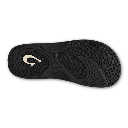 Black shoe sole with textured tread pattern and white curved logo detail on upper surface.