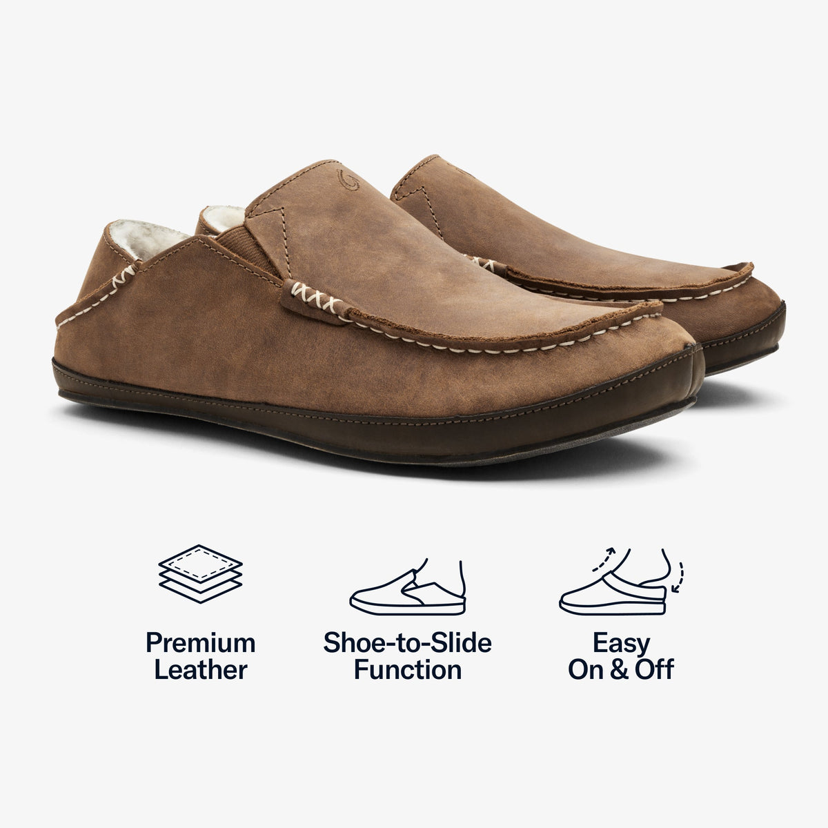 Toffee suede slippers with dark wood soles, cream fleece lining, and white stitching detail.
