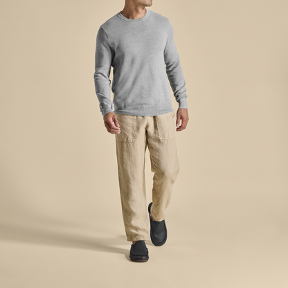 Black Moloā slipper with dark java accents worn on feet with casual outfit.