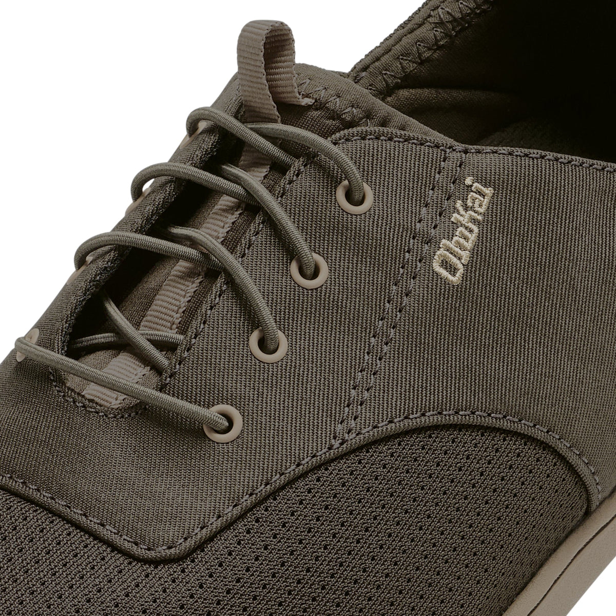 Olive canvas canteen shoe with lace-up front, padded collar, and textured sole.
