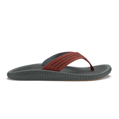 Gray thong sandal with perforated rust-colored upper strap and textured sole.