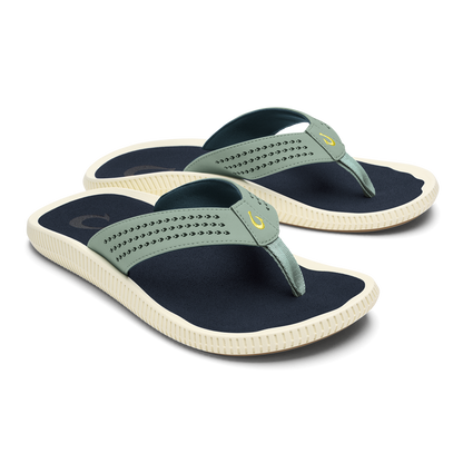 Pair of seagreen and navy thong sandals with textured straps and cream-colored ridged soles.