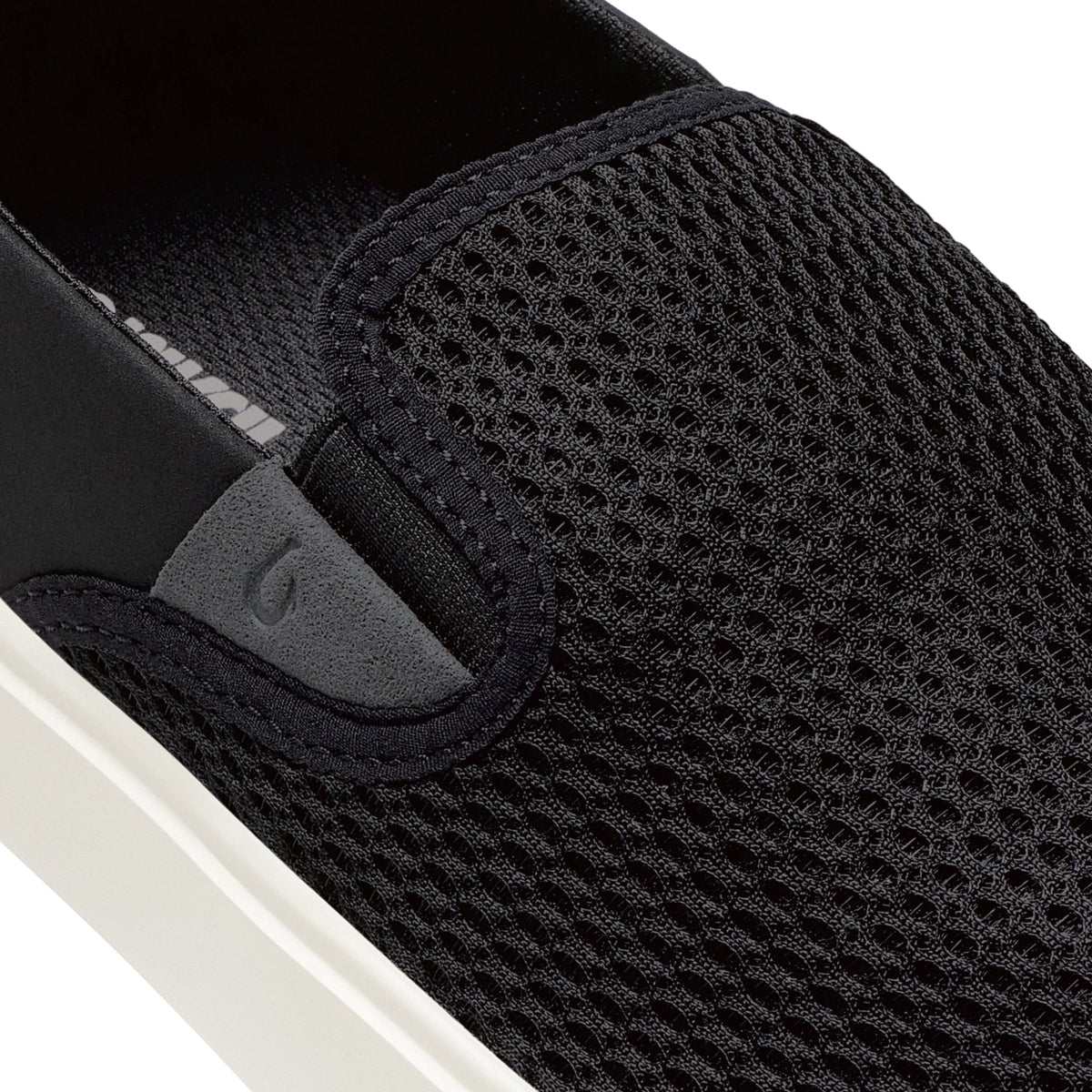 Black mesh slip-on sneaker with gray heel panel and white sole.