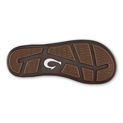 Brown and black shoe sole with textured tread pattern and white curved logo.