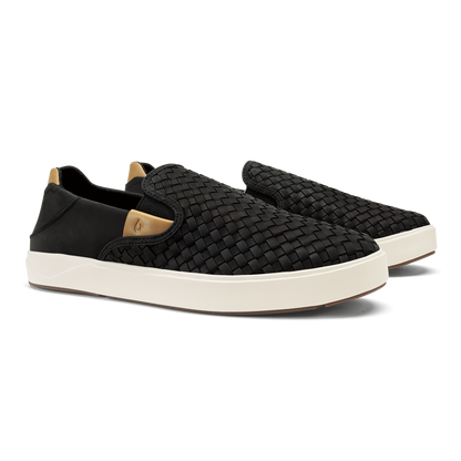 Black woven slip-on sneaker with cream sole and tan heel patch.