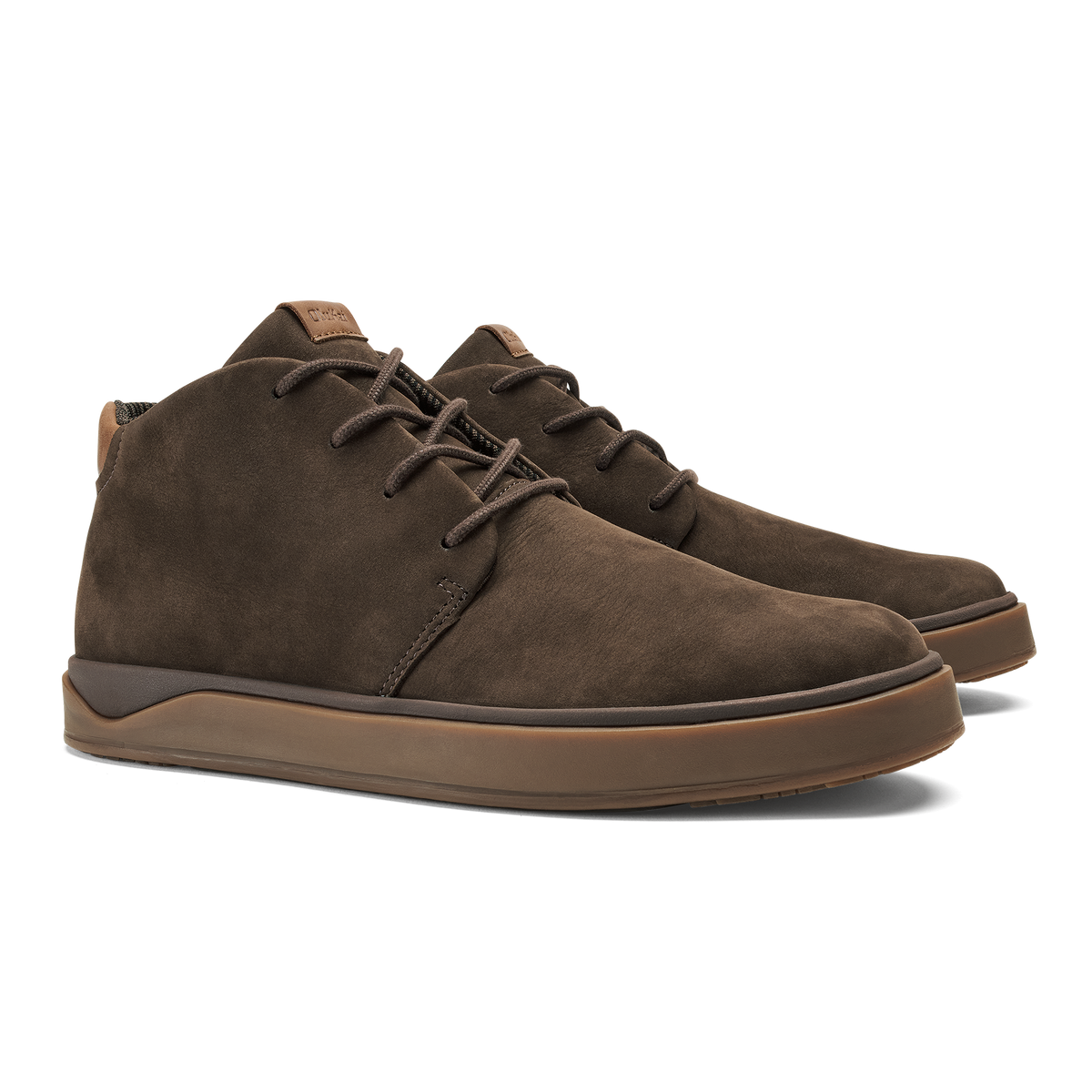 Pair of dark brown suede chukka boots with tan rubber soles and lace-up closure.