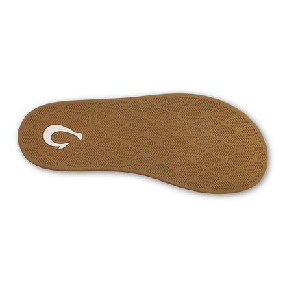 Tan rubber sole with herringbone tread pattern and white logo detail.