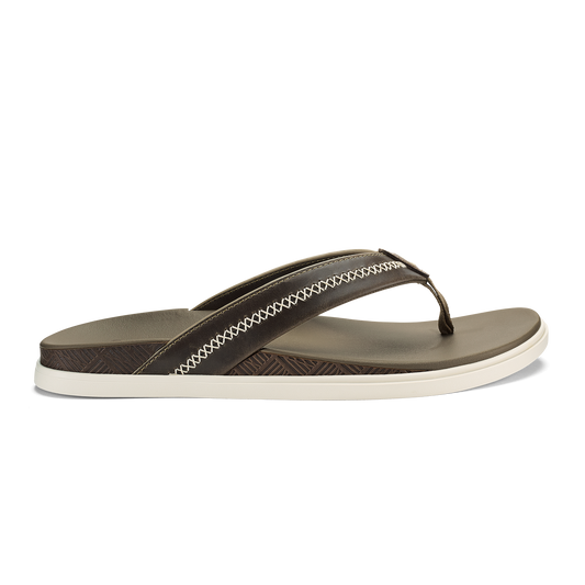 Brown and cream thong sandal with textured footbed and white stitched trim on upper strap.