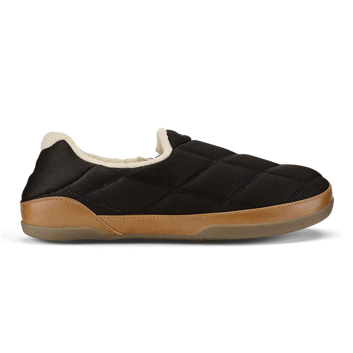 Black quilted slip-on slipper with tan leather trim and cream fleece lining.