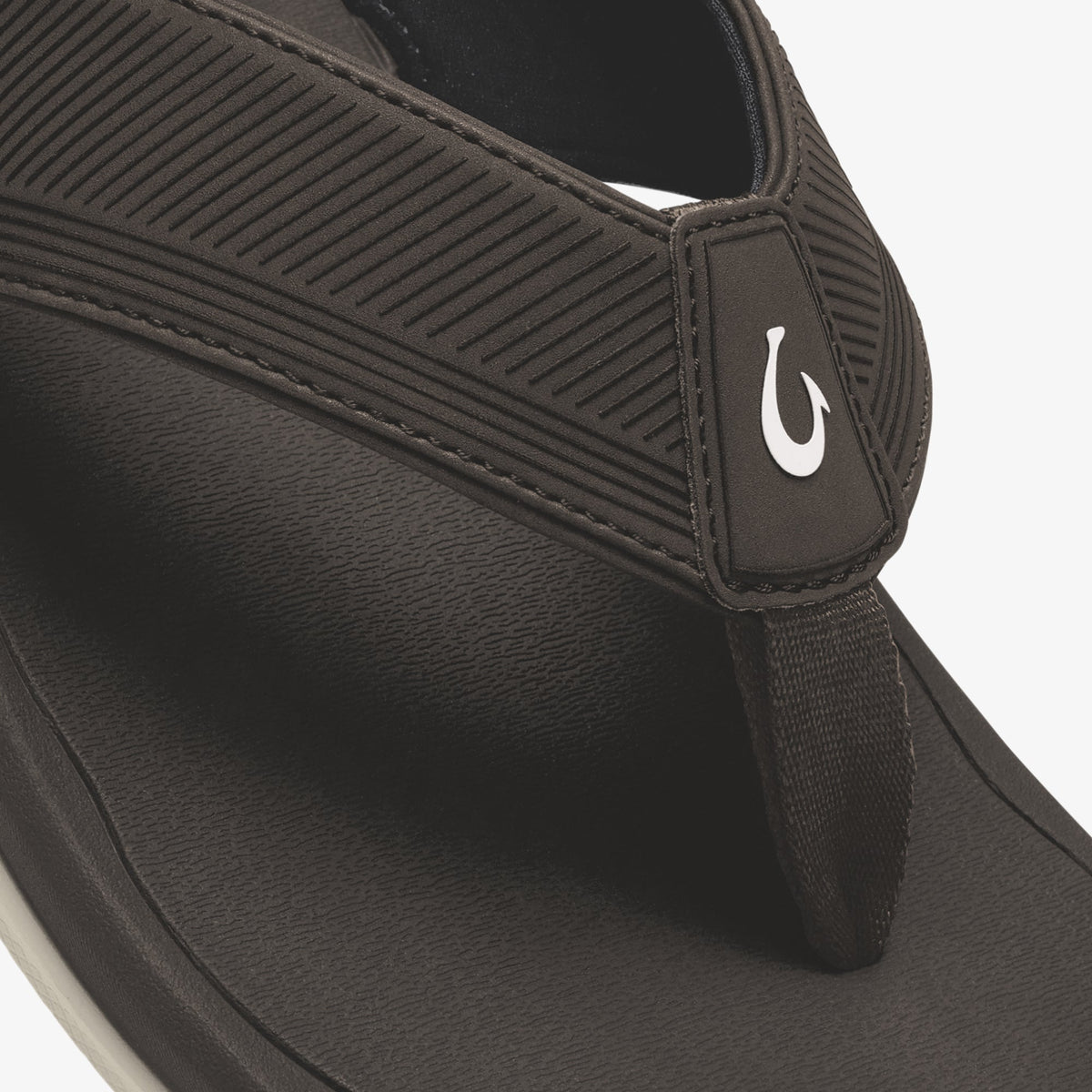 Dark Java flip-flop with ribbed textured straps and white logo accent on heel tab.