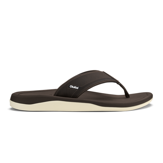 Dark brown thong sandal with cream-colored sole and textured upper strap.