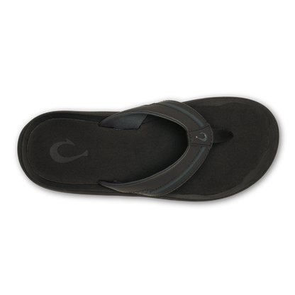 Black thong sandal with textured sole and curved leather toe post, shown from above.