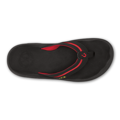Black flip-flop sandal with red curved strap and toe post, viewed from above.