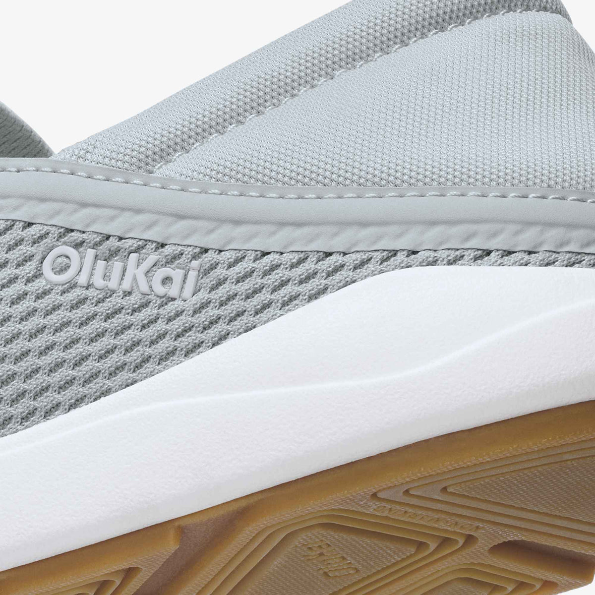 Cloud grey and ash slip-on shoe with textured mesh upper, white midsole, and gum rubber outsole.