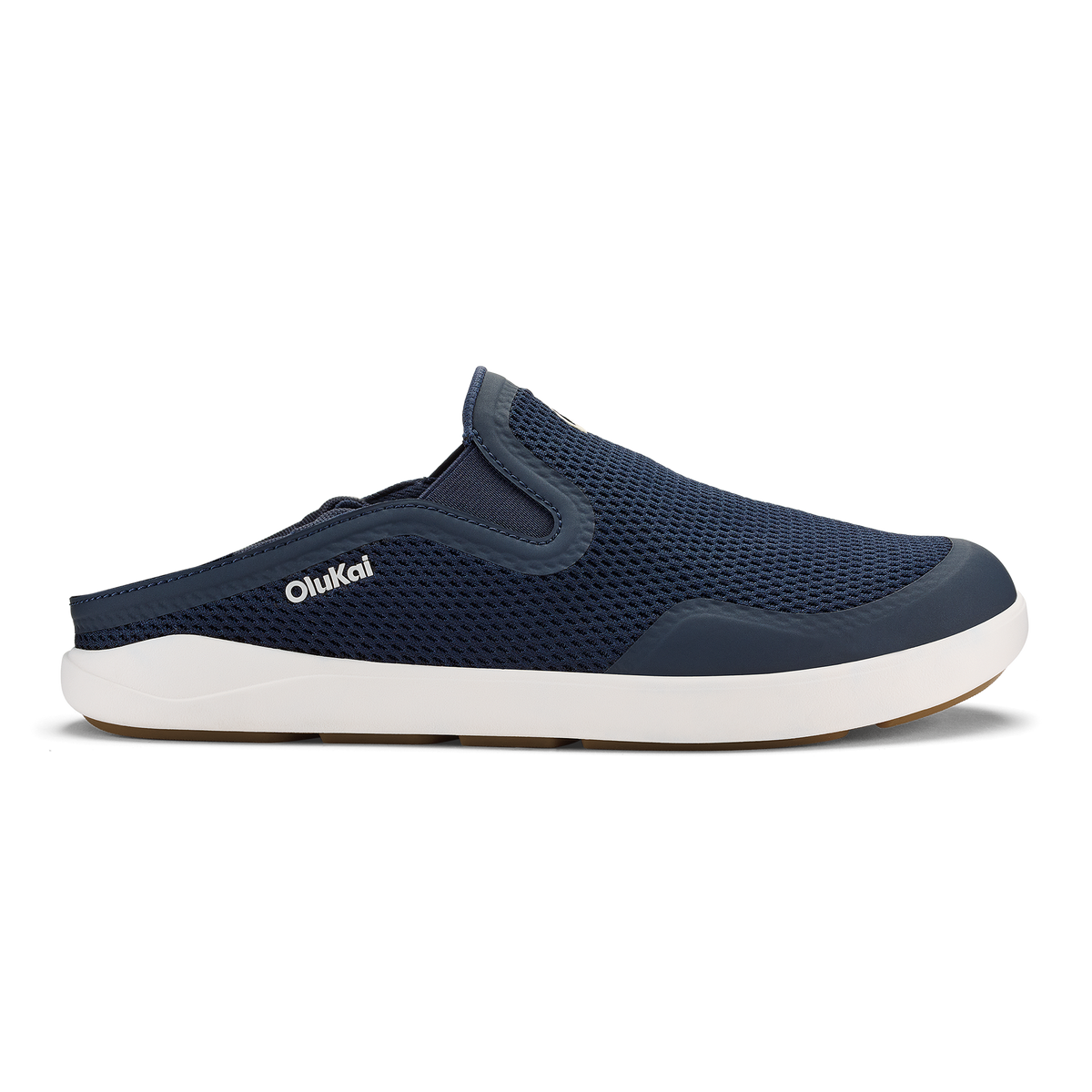 Trench blue slip-on mule shoe with white sole and mesh upper panel featuring OluKai branding.