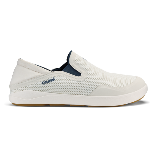 White and navy slip-on shoe with mesh upper and white sole, shown in side profile view.