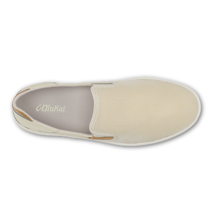 Cream and tan slip-on shoe with textured upper and gray insole, viewed from above.