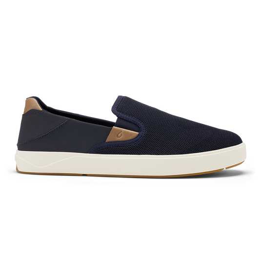 Navy blue slip-on sneaker with tan heel panel and cream rubber sole.