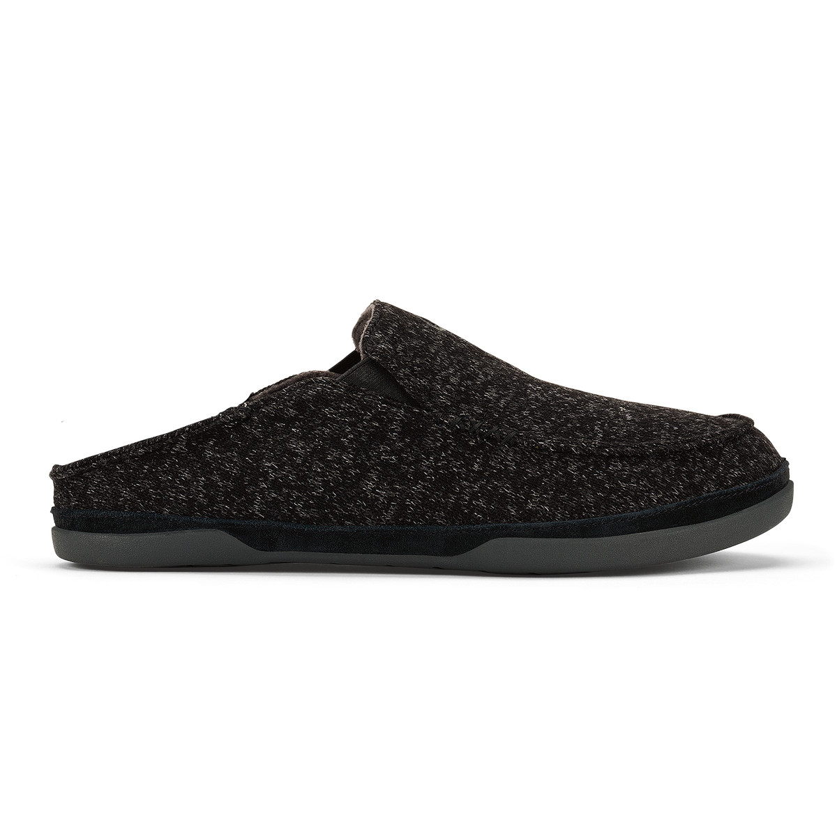 Black knit slip-on clog slipper with gray sole against white background.
