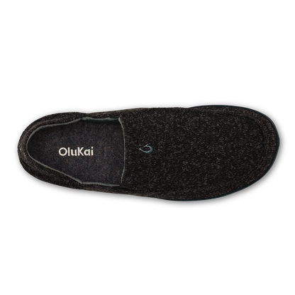 Black OluKai Hulu slipper with textured knit upper and suede collar, shown from above.
