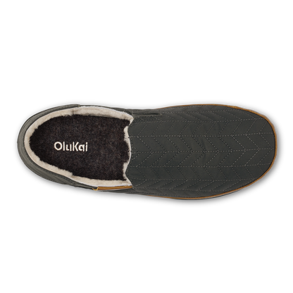Dark quilted slipper with black fleece lining and tan trim, shown from above.