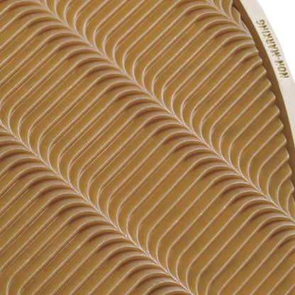 Tan chukka boot with white stitched wave pattern detail on upper.