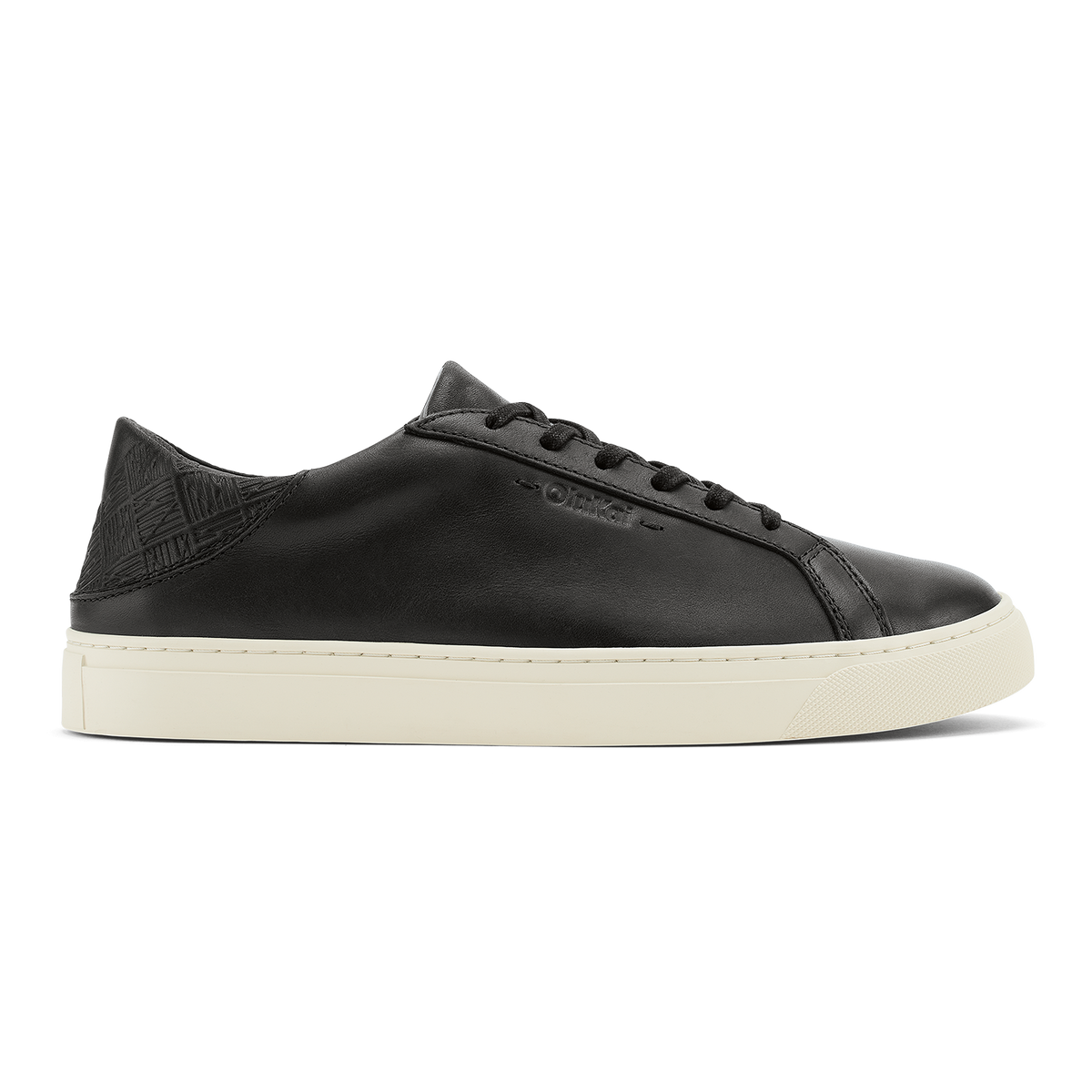 Black leather lace-up sneaker with cream rubber sole and textured heel panel.