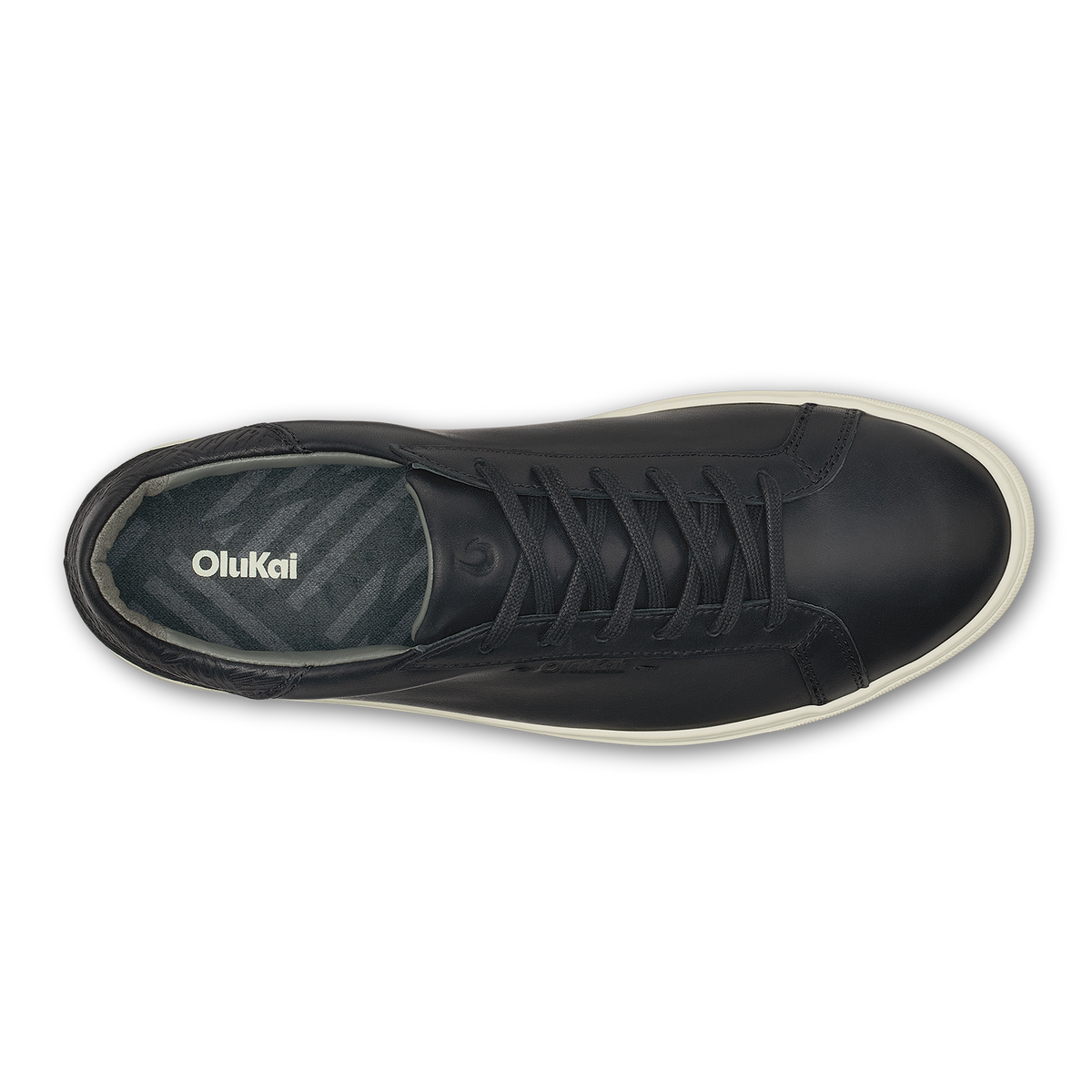 Black lace-up high-top sneaker with cream-colored sole and OluKai branding on the tongue, shown from above.
