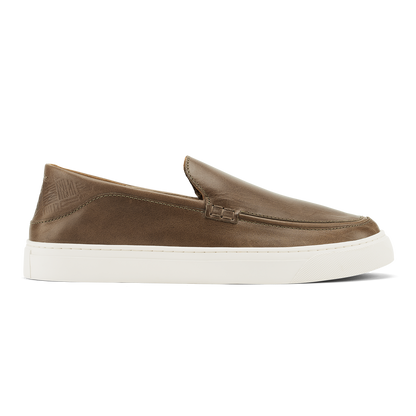 Walnut leather slip-on loafer with white rubber sole and stitched topline detail.