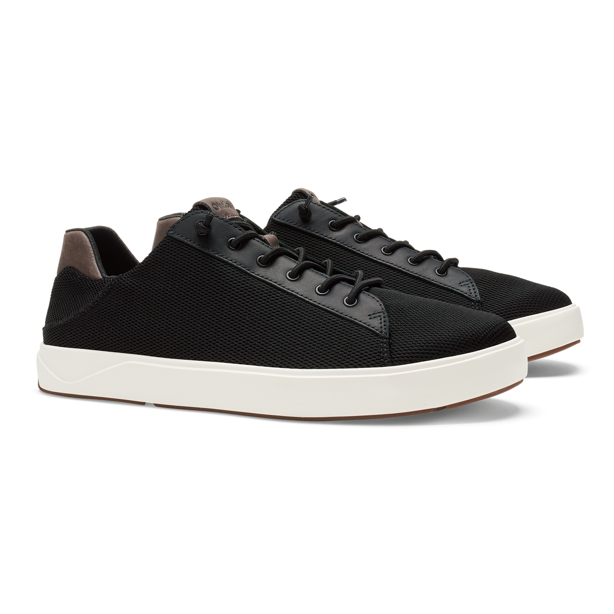 Black lace-up sneaker with textured fabric upper, gray suede panels, and white rubber sole.