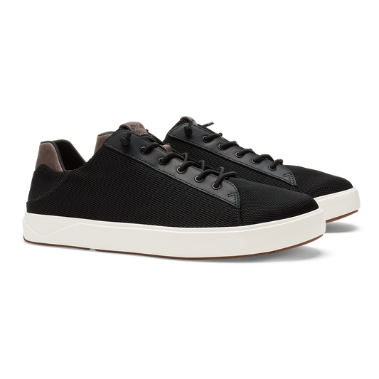 Black lace-up sneaker with textured fabric upper, gray suede panels, and white rubber sole.