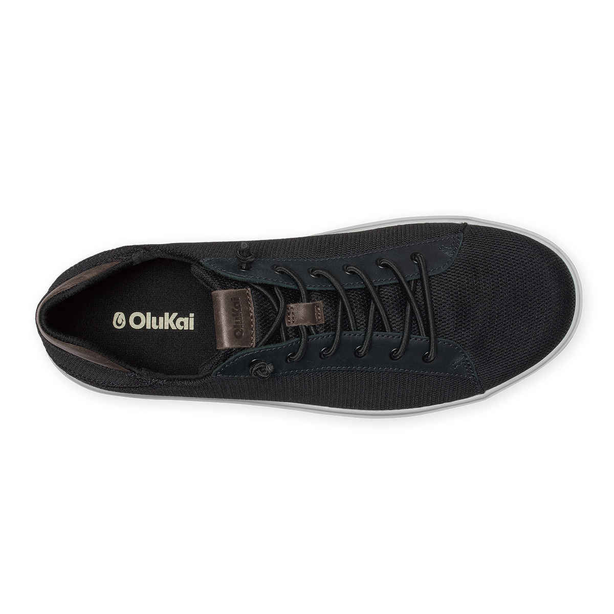 Black lace-up sneaker with textured canvas upper, brown leather heel tab, and white sole, shown from above.