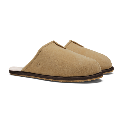 Pair of tan suede slip-on slippers with dark brown trim and crepe sole.