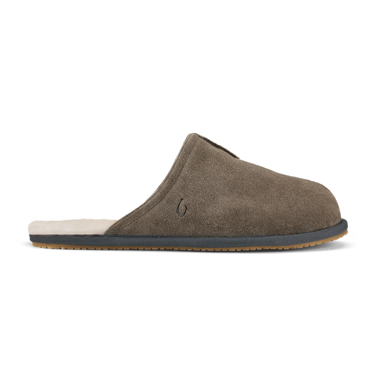 Walnut suede clog slipper with dark shadow trim, cream fleece lining, and textured rubber sole.