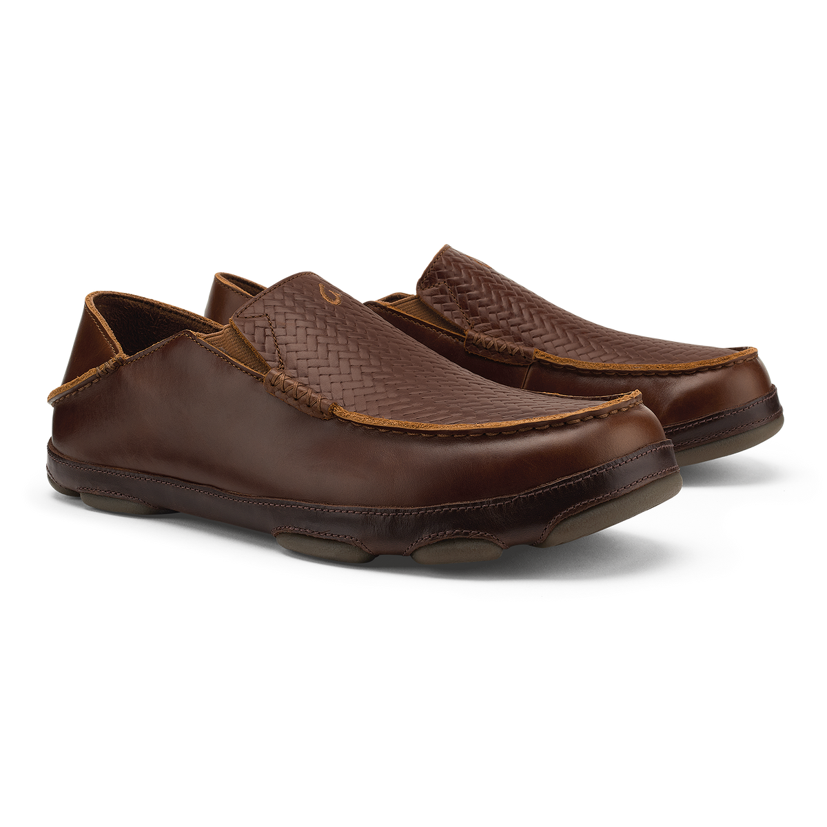 Pair of brown leather slip-on loafers with woven upper panels and tan stitching detail.