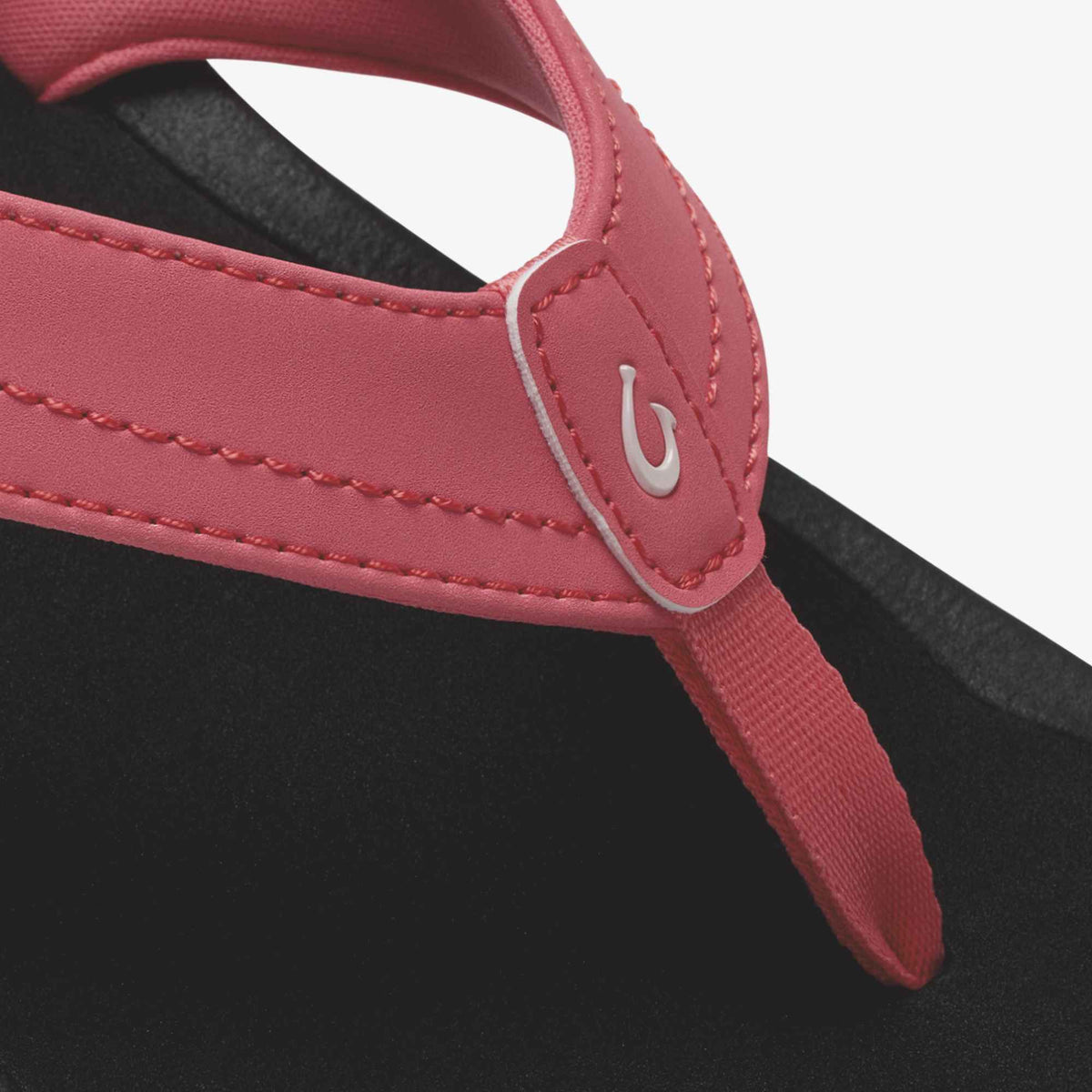 Hot pink and black flip-flop sandal with padded strap and logo detail.