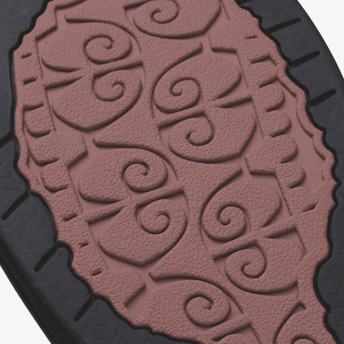 Coral rose textured mat with embossed scrolling floral design and dark border on edges.