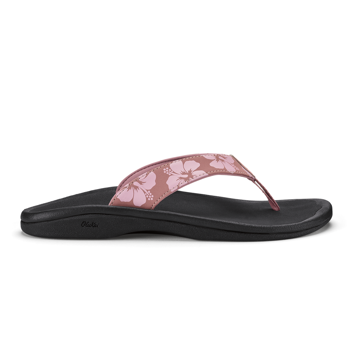 Coral rose flip-flop sandal with black sole and floral patterned upper strap.