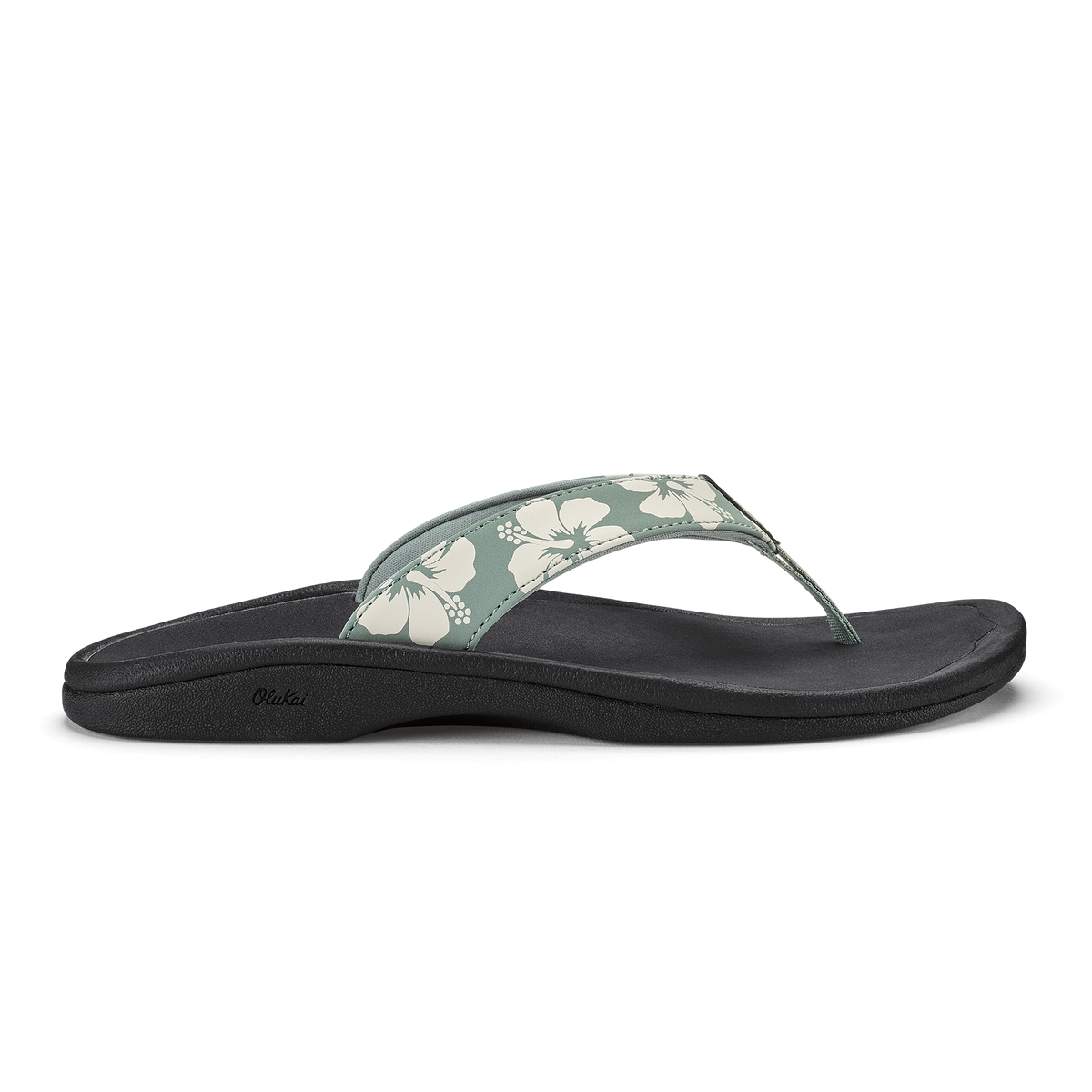 Thong sandal with silver-green floral printed strap and black cushioned footbed.