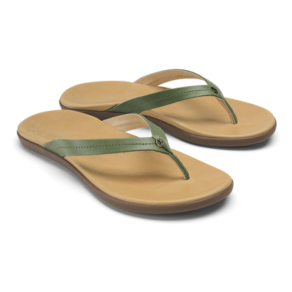 Pair of flip-flop sandals with golden sand footbeds and green olive straps.