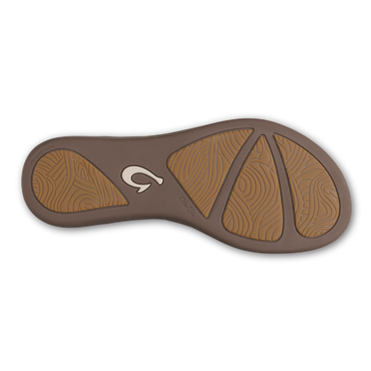 Sole of sandal with green olive brown upper and golden sand textured footbed pattern with logo detail.