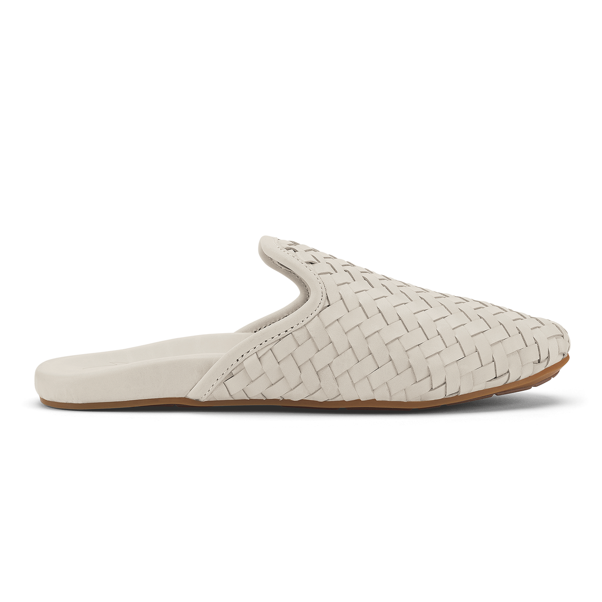 Cream-colored woven leather mule slipper with tan sole, shown in profile view.