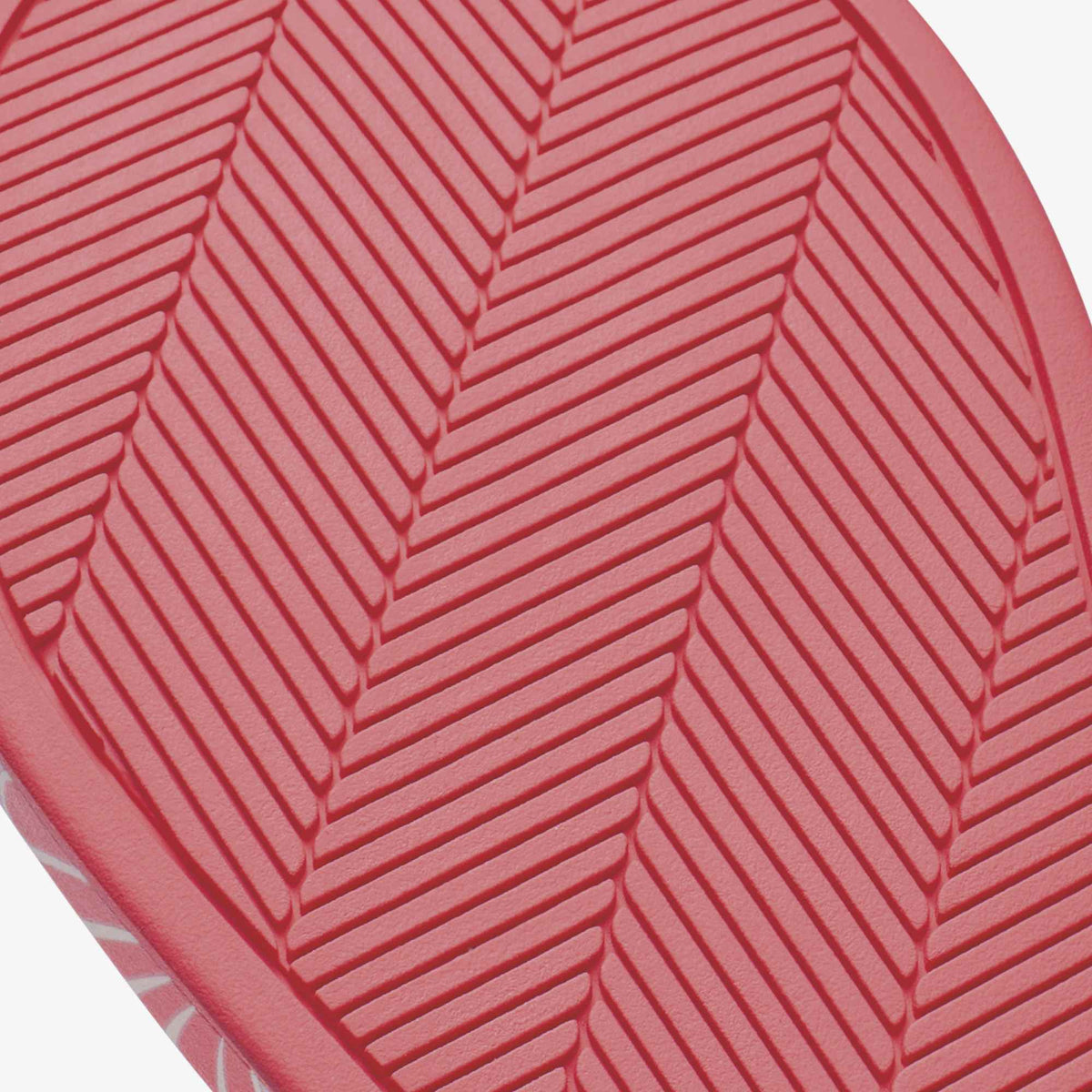 Hot pink sole with herringbone tread pattern.