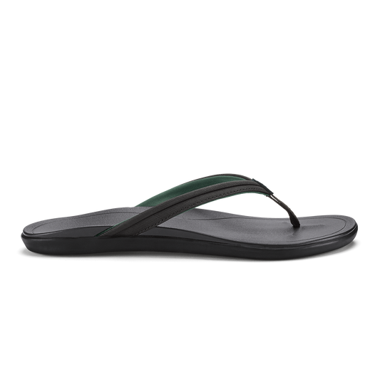 Black and dark green flip-flop sandal with textured footbed and thong strap, shown in side profile.